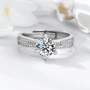 Classic 6-claw silver ring with 1-carat round cubic zirconia and double-row side stones
