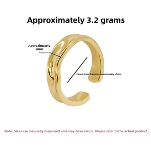 Detail showing irregular wavy gold ring with 5mm width and 17mm inner diameter