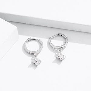 Elegant S925 sterling silver huggie earrings with four-leaf clover zircon pendants