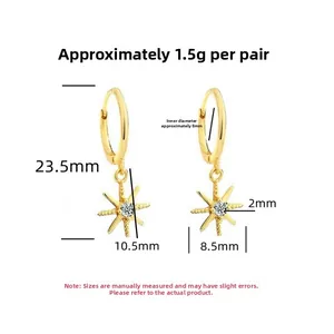 Detailed view of gold star earrings with 1.5g weight and 23.5mm total length dimensions