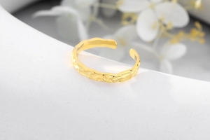 Detail shot of S925 hallmark on irregular gold-plated hammered texture open ring