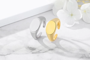 Detailed macro shot of S925 sterling silver stamp on minimalist gold and silver rings