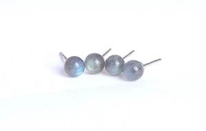 Macro shot of S925 silver stud earrings with natural labradorite blue moonstone beads