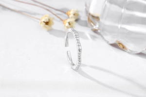 Macro detail of S925 sterling silver ring featuring fine horizontal textured engraving