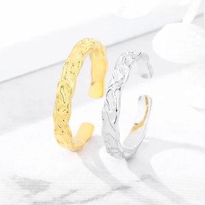 Close-up of S925 sterling silver open rings with irregular hammered tin foil texture