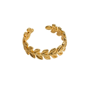 Macro detail of golden olive leaf open ring showing smooth metallic texture and adjustable band