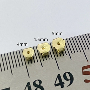 Macro view of 4mm to 5mm S925 silver earring backs with size scale and S925 engraving