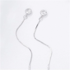 Close-up of S925 sterling silver tassel drop earrings with sparkling cubic zirconia studs