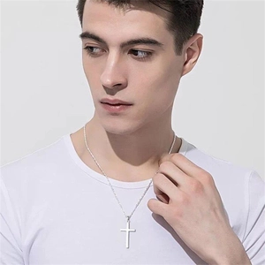 S925 sterling silver cross pendant necklace on male model with clean gray background