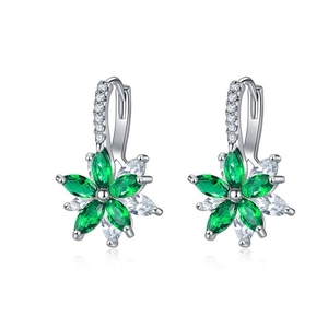 Detail view of silver floral earrings with green marquise stones and sparkling accents