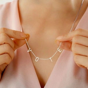 S925 sterling silver VOTE letter necklace shown on neck with minimalist style