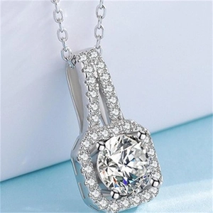 Macro shot of S925 sterling silver necklace with large round pave set diamond pendant