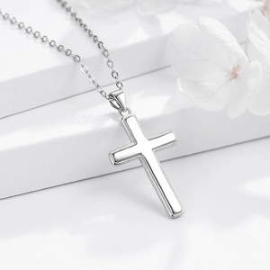 Elegant S925 sterling silver cross pendant necklace with minimalist O-chain on white display