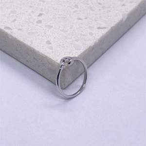 Detailed view of an adjustable S925 sterling silver star ring on a textured grey surface