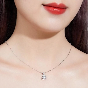 Elegant S925 sterling silver necklace with a square halo pendant worn by a model