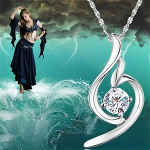 Detail showing an S925 silver swirl pendant with a brilliant cut cubic zirconia stone