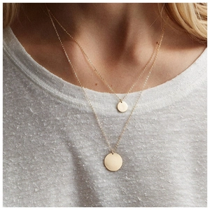 Double-layered gold S925 sterling silver necklace featuring two polished round coin pendants