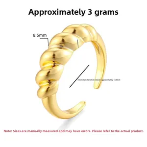 Detailed view of golden twisted rope ring showing 8.5mm width and 16.8mm diameter