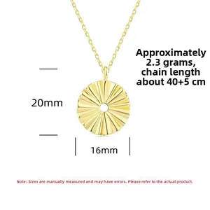 Detail of sunflower pendant necklace showing 20mm round textured sunburst disc and gold chain