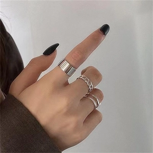 Close-up of minimalist S925 sterling silver chain ring set on fingers for women
