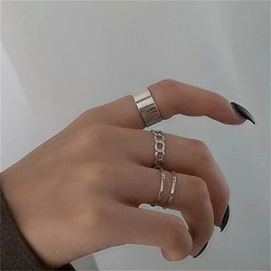 Close-up of S925 sterling silver chain rings on hand featuring adjustable open band design