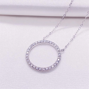 Elegant S925 sterling silver circle pendant necklace featuring pavé set cubic zirconia stones