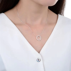 Close-up of S925 sterling silver necklace with sparkling pavé zircon circle pendant