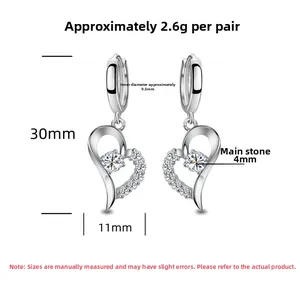 Detailed view of silver heart earrings featuring white zircon and precise dimensions