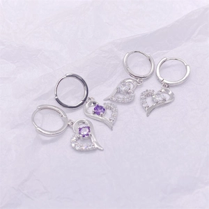 Detailed close-up of S925 sterling silver heart earrings with purple and white stones