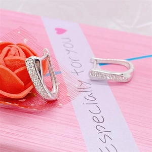 Elegant S925 sterling silver hollow cross huggie earrings with white cubic zirconia crystals