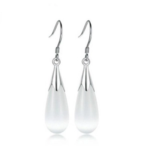Detailed view of silver cat eye teardrop earrings with elegant white translucent stones