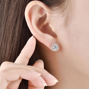 Close-up of S925 sterling silver halo stud earrings with brilliant round cubic zirconia