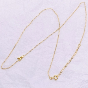 Detail of gold letter A pendant necklace with adjustable chain and spring ring clasp