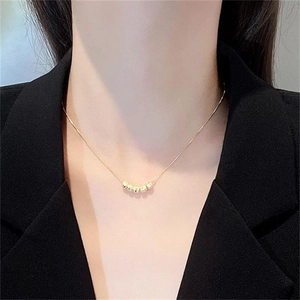 Minimalist S925 sterling silver necklace with five golden beads on fine chain