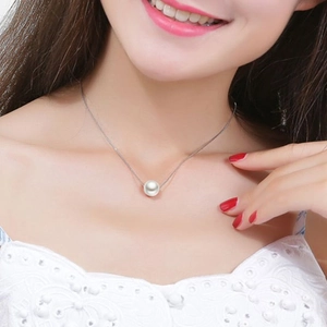 Elegant S925 sterling silver box chain necklace with a round white pearl on a female model