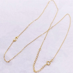 Detailed shot of gold plated S925 sterling silver S letter necklace with spring clasp