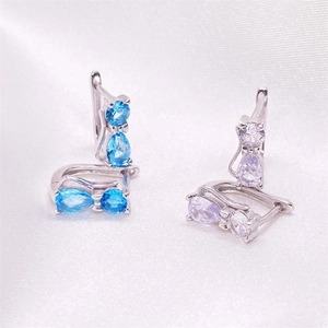 S925 sterling silver cat earrings with blue and purple cubic zirconia on white silk