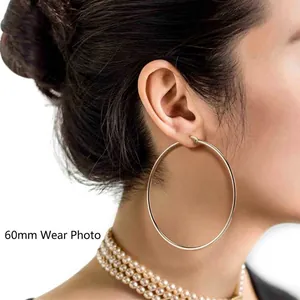 60mm large polished S925 sterling silver hoop earrings for women shown on model