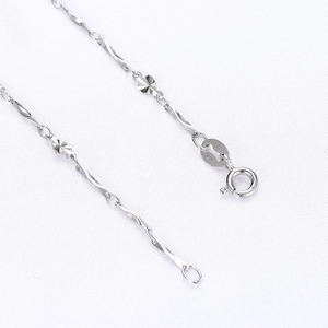 Detail of S925 sterling silver water wave chain with heart accents and spring clasp