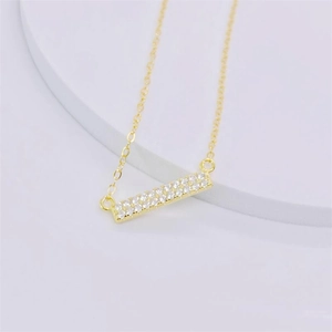 Elegant gold S925 sterling silver necklace featuring a rectangular bar pendant with cubic zirconia