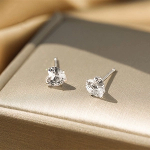 Classic S925 sterling silver heart-shaped stud earrings with four-prong cubic zirconia