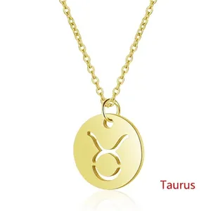 Macro shot of 925 sterling silver Taurus zodiac pendant with hollowed gold finish