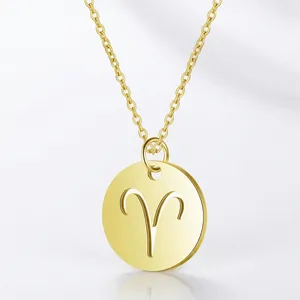 Detail of Aries zodiac pendant in gold plating with polished round disk and cross chain