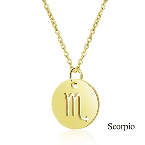 Macro shot of Scorpio zodiac pendant in gold finish with delicate cross chain