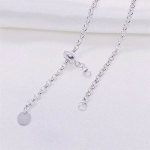 Macro detail of S925 sterling silver adjustable chain with lobster clasp and purity stamp