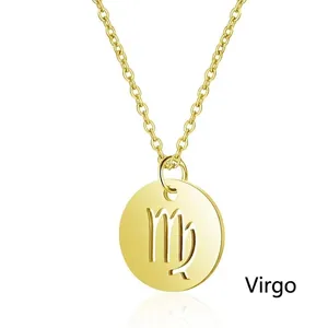 Detail of gold Virgo zodiac pendant with engraved astrological symbol on cross chain