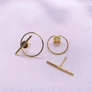 Minimalist geometric S925 sterling silver gold circle stud earrings on pink silk background