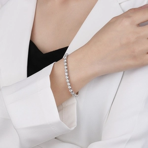 Close-up of S925 sterling silver tennis bracelet with cubic zirconia on a wrist