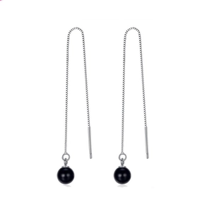 Detail view of S925 silver box chain drop earrings with elegant black onyx beads