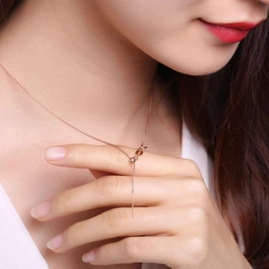 Close-up of adjustable rose gold S925 silver necklace featuring delicate Chopin chain links